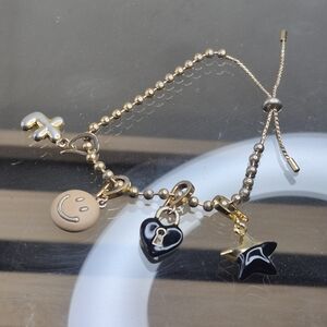 Gold Charm Bracelet with Black and Tan Accents